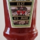 Fles Heinz-ketchup met opdruk "Heinz Elst 65 jaar".